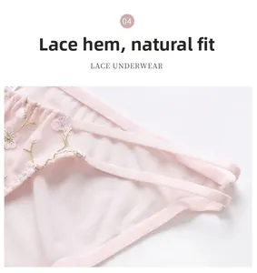 Gros plan de sous-vêtement en mesh rose avec broderie florale et lanières latérales
