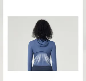 Detail view of the breathable mesh ventilation design on the back of the blue yoga jacket