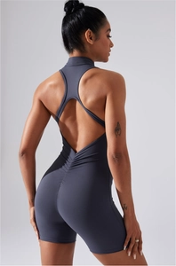 Detail of cross-back yoga bodysuit showing scrunch butt design and elastic matte fabric