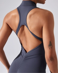 Detail view of dark grey yoga bodysuit with back cutout and ruching details