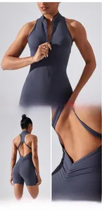 Detail of backless yoga bodysuit with cross straps and ruched peach butt lifting design