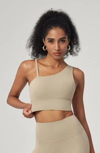 Detail of khaki asymmetrical one-shoulder sports bra with wide hem for extra support