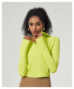Detail view of neon green slim-fit hooded yoga jacket with zipper and thumbhole cuffs