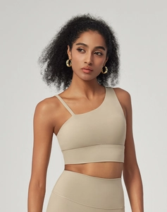 Detail of khaki asymmetrical one-shoulder sports bra with seamless high-waist yoga leggings