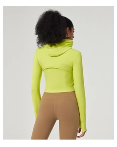 Rear view of hooded slim-fit yoga jacket in vibrant neon green with thumbhole sleeves