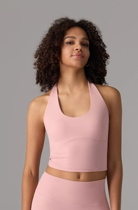 Pink halter yoga tank top with wavy stitching detail and high-elastic athletic fabric