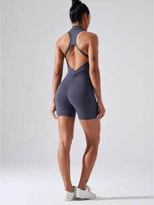 Dark grey open back yoga romper with scrunch butt detail and built-in padding