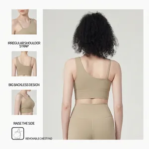 Asymmetric beige sports bra with one-shoulder strap and open back for yoga and fitness