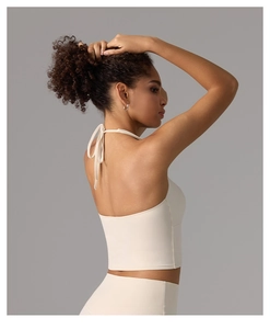 Detail of the halter neck straps and tie-back design on this beige yoga sports tank top