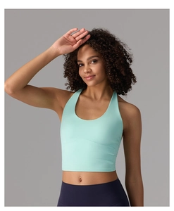 Close-up of mint green yoga sports bra featuring a U-neck and racerback cut design