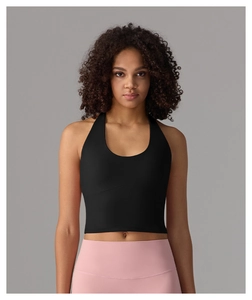Detail of black halter yoga tank top with integrated cups and ribbed elastic fabric