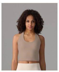 Close-up of slim fit halter yoga tank top in khaki color featuring integrated cups