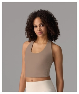 Close-up of earth tone halter yoga crop top featuring a deep U-neckline design