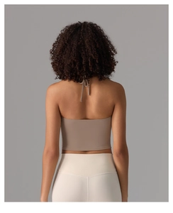 Detail view of backless halter yoga crop top with elastic criss-cross back straps