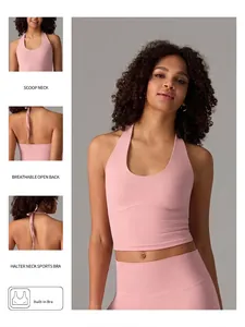 Pink halter neck sports bra with scoop neck and breathable open back design