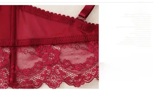 Detail of wide side wings with lace fabric and built-in boning for women's red bra