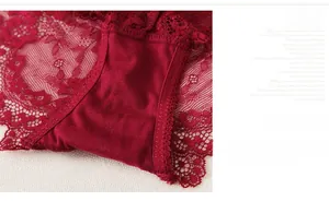 Detailed macro view of deep red floral lace panties with comfortable soft cotton lining