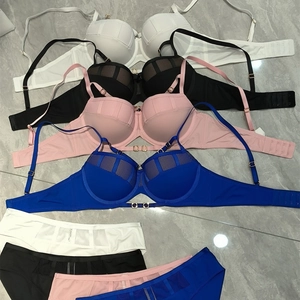 Flat lay of push-up lingerie sets in white, black, pink, and blue with mesh panels