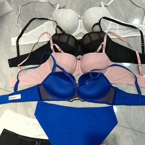 Lace mesh push-up bra and panty sets in black white pink and blue on marble tiles