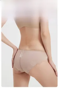 Detailed back view of beige lace panties showing floral embroidery and mesh design