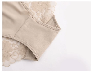 Close-up of floral lace detail and reinforced stitching on the beige cotton crotch panties