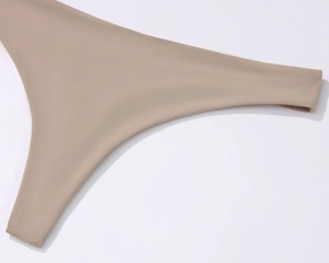 Detailed macro view of the smooth seamless edge and high-elastic fabric of the bra