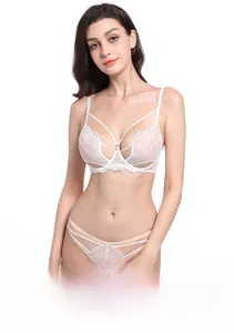 Close-up of fine floral lace lingerie set with semi-transparent bra and strappy details