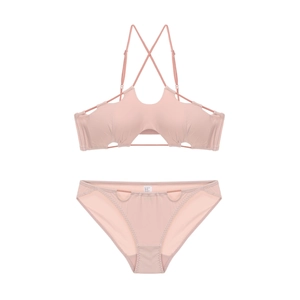 Two-piece pink bikini set with hollow geometric cutout design and cross halter straps