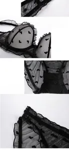 Detailed close-up of black lace lingerie set with heart mesh pattern and cotton lining
