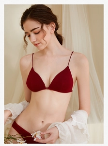 Detailed view of dark red wireless bra set with thin straps and front buckle closure