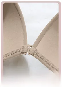 Detailed macro view of the secure front closure buckle on a seamless nude bra