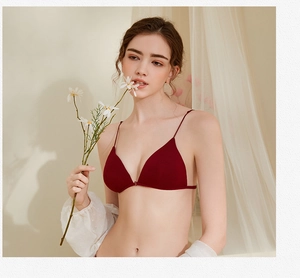 Detailed close-up of dark red French triangle bra with thin straps and seamless finish