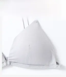 Detailed macro view of thin knitted fabric and stitching on a seamless light grey bra