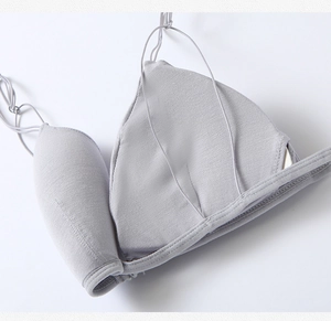 Detailed close-up showing inner padding lining and fine stitching of grey bra