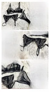 Dettaglio di un set lingerie in pizzo nero con ricami floreali e fibbie in metallo