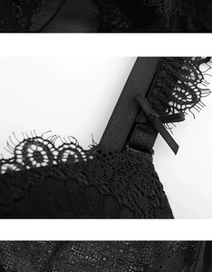 Dettaglio del body in pizzo nero con bordo a ciglia e piccolo fiocco decorativo
