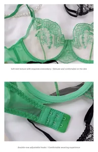 Detail of floral embroidery on sheer mesh cups and back closure of green lace bra