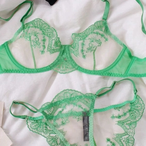Emerald green lace lingerie set with floral embroidery and underwire support