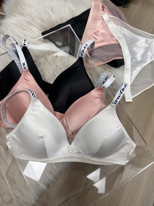 Detailed display of satin lingerie sets with Flawless lettering on straps in three colors
