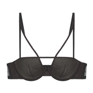 Close-up of black mesh bra featuring thin straps and crisscross cutout design details