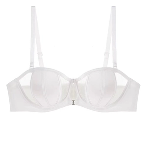 Detail of white satin bra with mesh panels and adjustable straps on plain background
