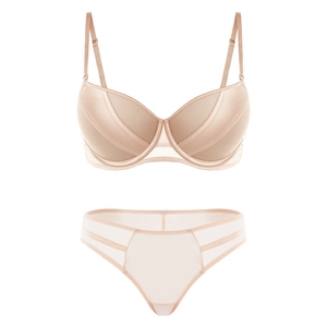 Detailed view of nude mesh patchwork lingerie set with underwire bra and hollow panties