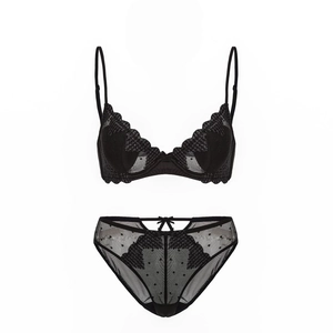 Close-up of black lace lingerie set with heart embroidery and mesh detailing