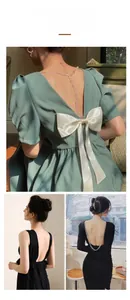 Various styles of women U-shaped backless outfits featuring bows and metal chains