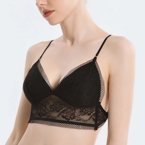 Detail of delicate floral black lace bralette with triangle cups and mesh band