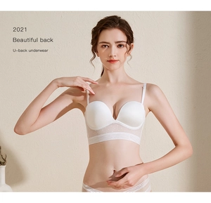 Detail of white U-back bra featuring seamless cups and translucent mesh back band