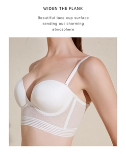 Detailed view of white lace bra featuring widened flanks and adjustable straps