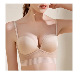 Detail view of beige push-up bra featuring mesh lace underband and removable straps