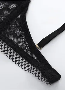 Close-up of black lace bra detail featuring extended underband and golden metal buckle