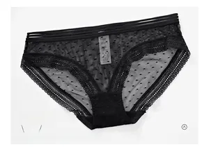 Close-up of black lace panties with polka dot mesh and hollow triple-waist strap design